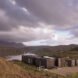 elongated timber home looking out over landscape