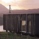 elongated timber home looking out over landscape