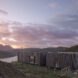 elongated timber home looking out over landscape