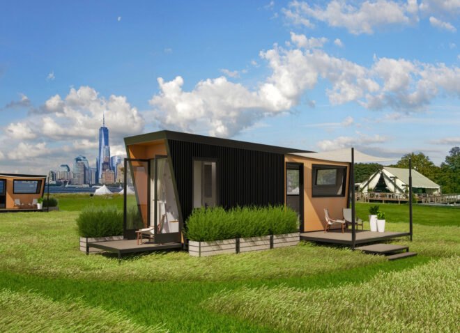 black tiny home with two wood decks on an island
