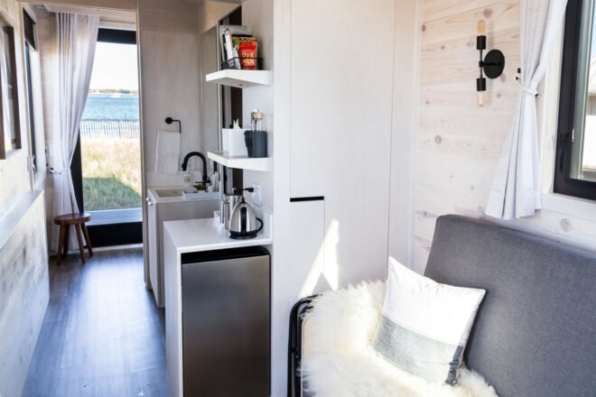 mini kitchen and living space inside tiny home