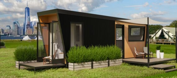 black tiny home with two wood decks on an island