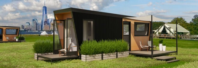 black tiny home with two wood decks on an island