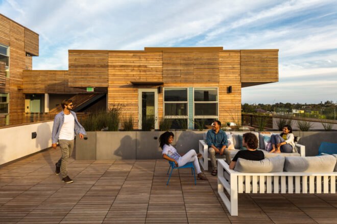 friends talking and lounging on an outdoor deck