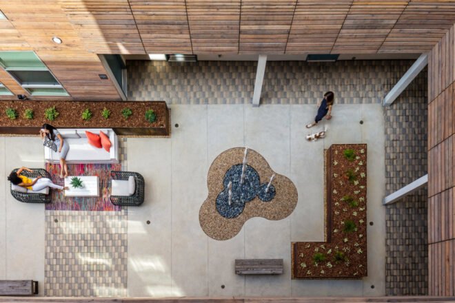 aerial view of patio with white sofa and chairs and a raised garden