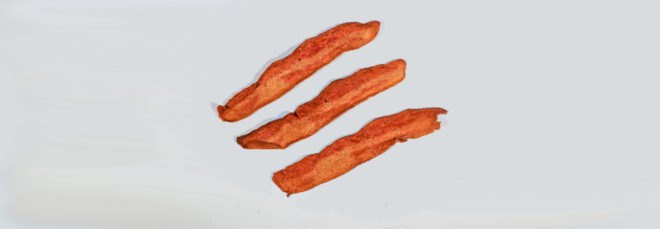 meatless bacon on gray background
