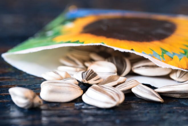 sunflower seeds spilling out of a packet