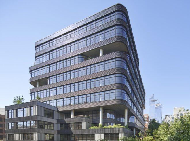 a tall building with floor-to-ceiling windows