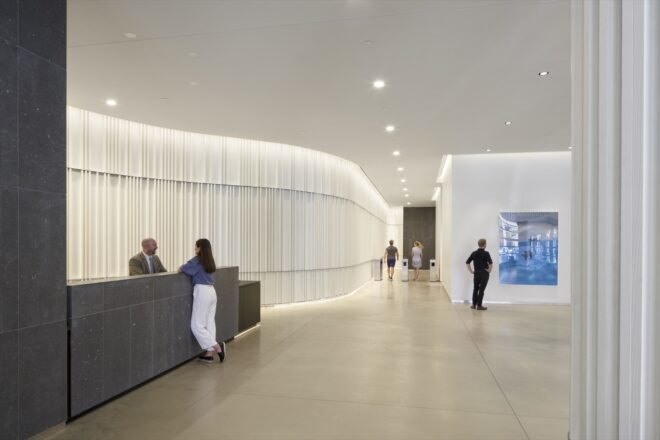 an interior lobby space with white walls and ceiling