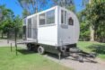 small white camper on wheels