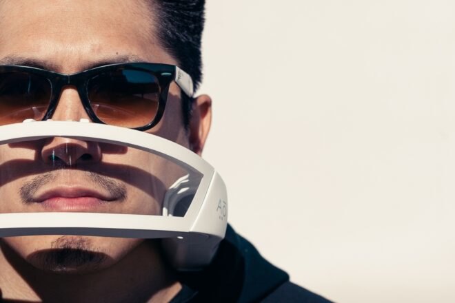 man wearing sunglasses and white mask
