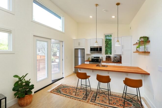kitchen with island with three bar stools