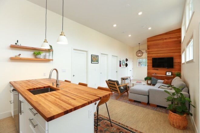 tiny home living space with wooden kitchen island