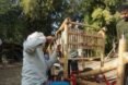 person working on bamboo bike