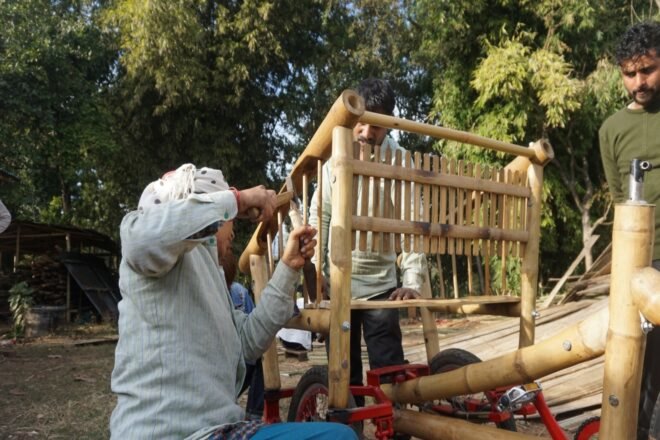 person working on bamboo bike