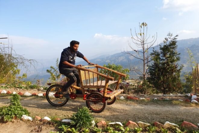 person riding a bamboo bike on remote path