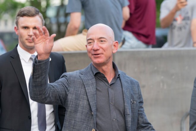 Jeff Bezos waving to photographers
