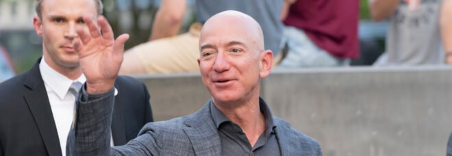 Jeff Bezos waving to photographers