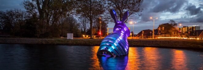 3d-printed bunny sculpture glowing with blue and purple LED lights