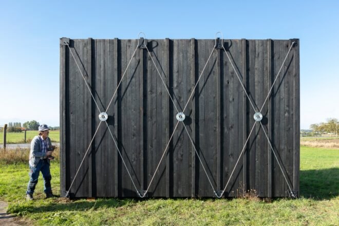 black siding on tiny cabin