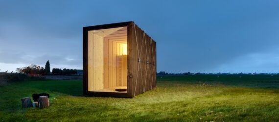 tiny cabin on green landscape