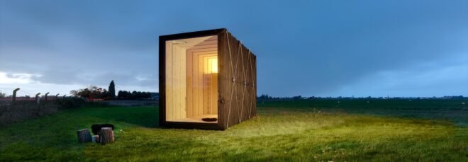tiny cabin on green landscape