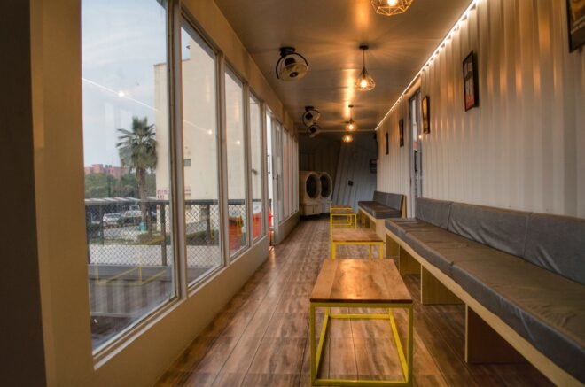 cafe interior with large windows and bar-style seating