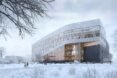 large white building with patterned facade in a snowy landscape
