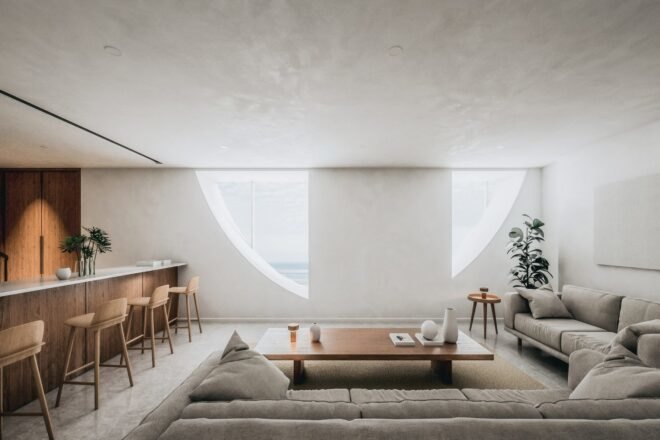 a modern interior room with bright concrete walls and wood furnishings