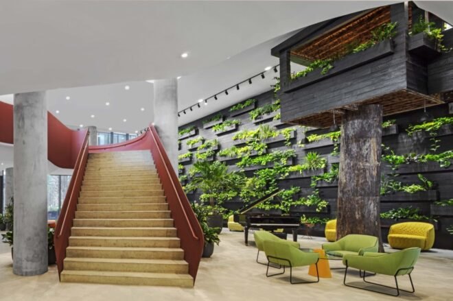 interior stairwell with a green plant wall next to it