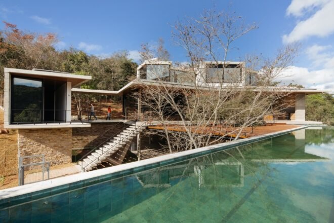 large home with multiple levels and swimming pool