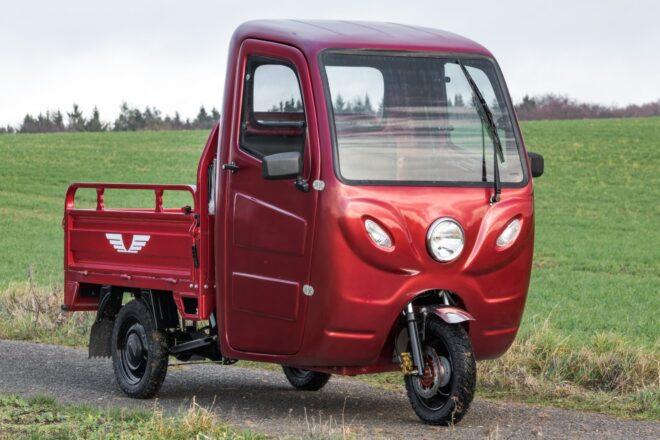 red electric truck with three wheels