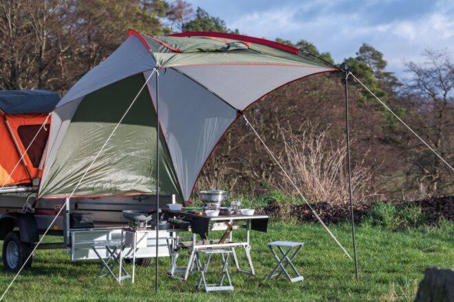 An extended tarp with table underneath