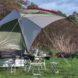 An extended tarp with table underneath