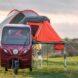 Little red vehicle with an orange camper on top