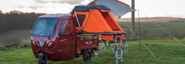 red camper with orange tent