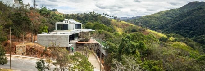 winding path leading up to home overlooking a hill