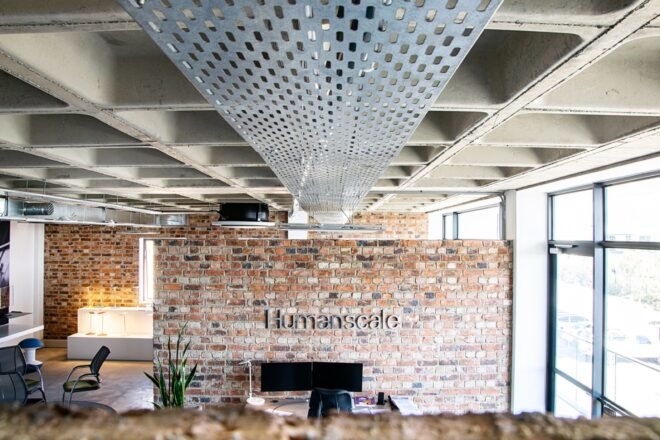 a brick wall with a sign saying "Humanscale"