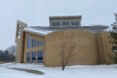the exterior of Holy Wisdom in the snow. the building has a tan facade with angular windows