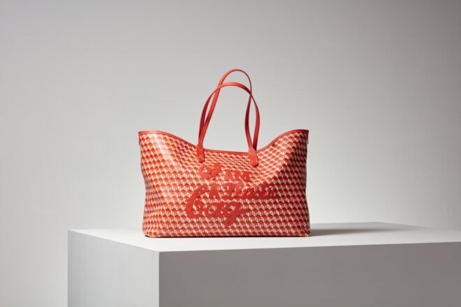 red tote bag on white cube