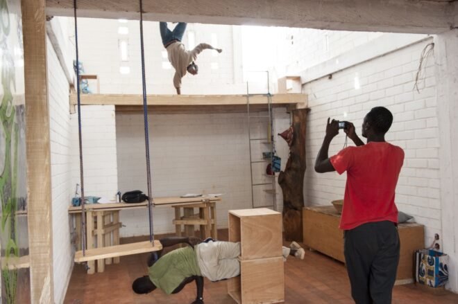 people climbing on wood lofts