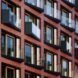close-up up small angled balconies on a brick building