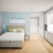 white and light blue bedroom with a gray tufted headboard and large windows