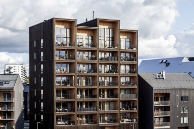 tall dark wood building with jagged roofline