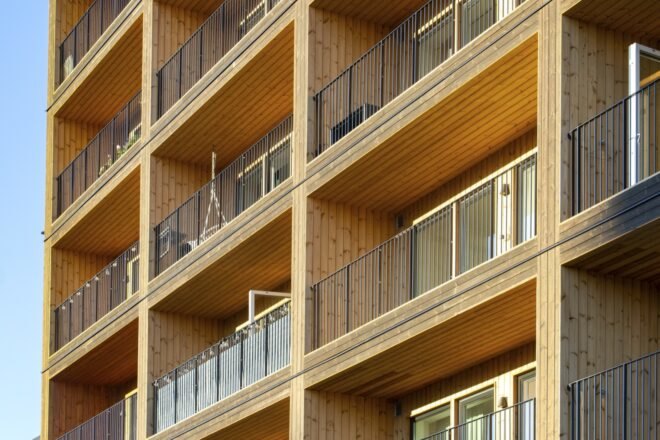 close-up of enclosed balconies on a wood building