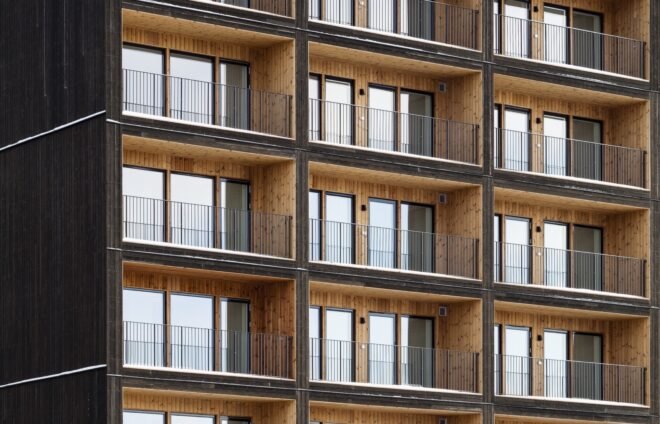 balconies and tall windows on a wood building