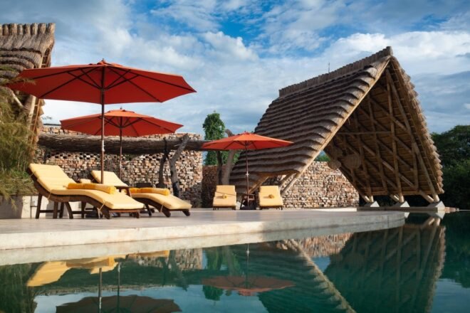 outdoor shot of swimming pool with lounge area