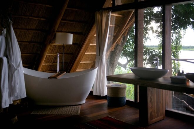 a large soaking tub adjacent to a window