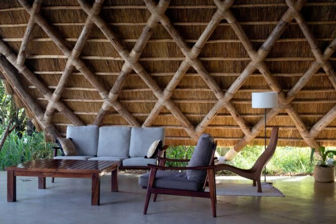 a lounge area with sofa and chairs