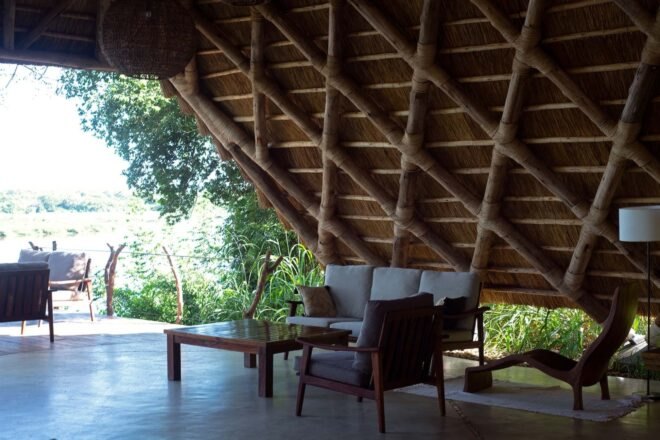 an open lounge area with wooden walls